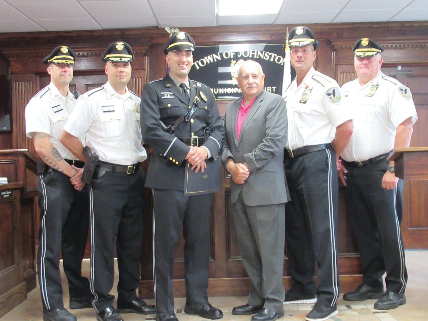 SARGE’S SUPPORTERS: Newly promoted Sgt. Andrew Broccoli is joined by Mayor Joseph Polisena and Chief Joseph P. Razza and other officers who will offer their fullest support as he begins another chapter in his law enforcement career.